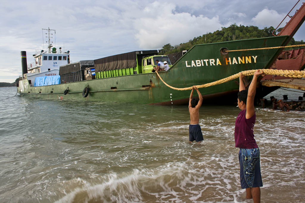 A World Food Program ship loaded with rice arrives in Calang port. Calang was one of the most punished towns in the world by tsunami, around 85% of the population died due to it was located in a small peninsula crushed at the same time by two giant waves coming from opposite directions. One year after 2004 December 26 tsunami reportage. Banda Aceh, Aceh province, Sumatra, Indonesia.. One year after 2004 December 26 tsunami reportage. Calang, Aceh province, Sumatra, Indonesia.